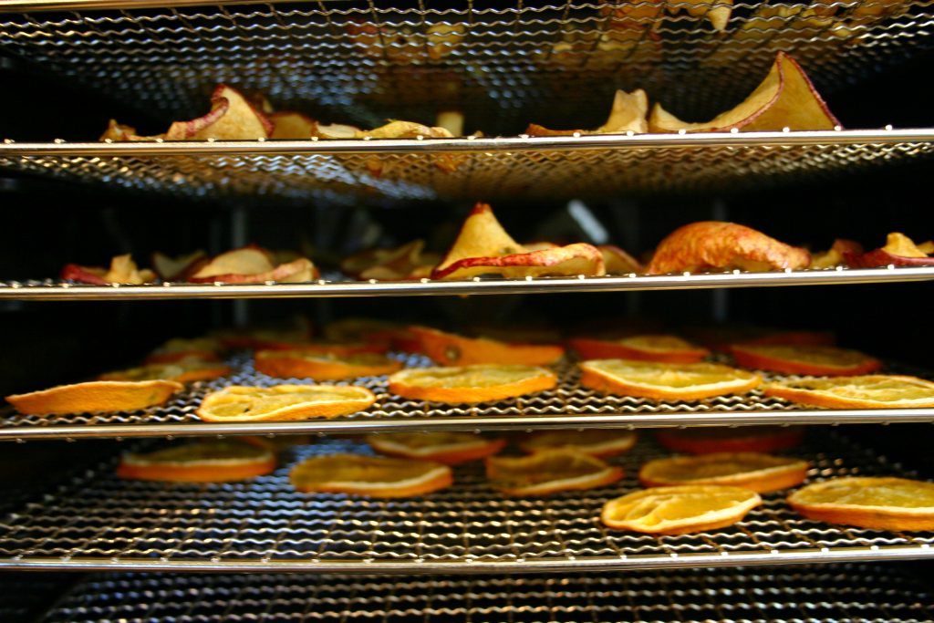 trays of fruit in a dehydrator