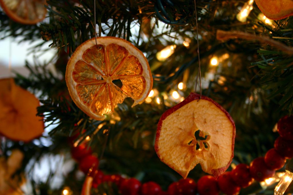 dried orange and apple on a Christmas tree