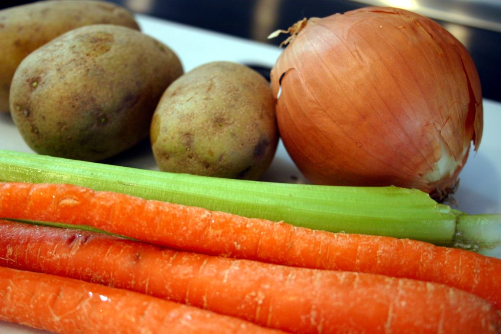 vegetables used in a chicken recipe: onion, potato, celery, and carrot