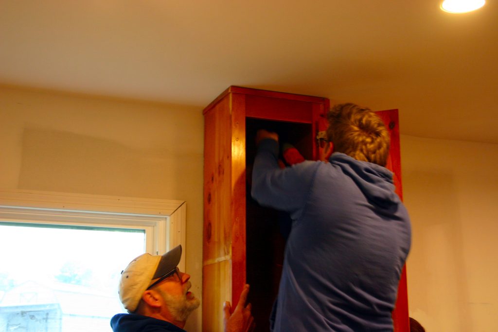 Drilling upper cabinets into place