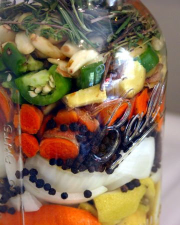 many ingredients in a mason jar for fire cider