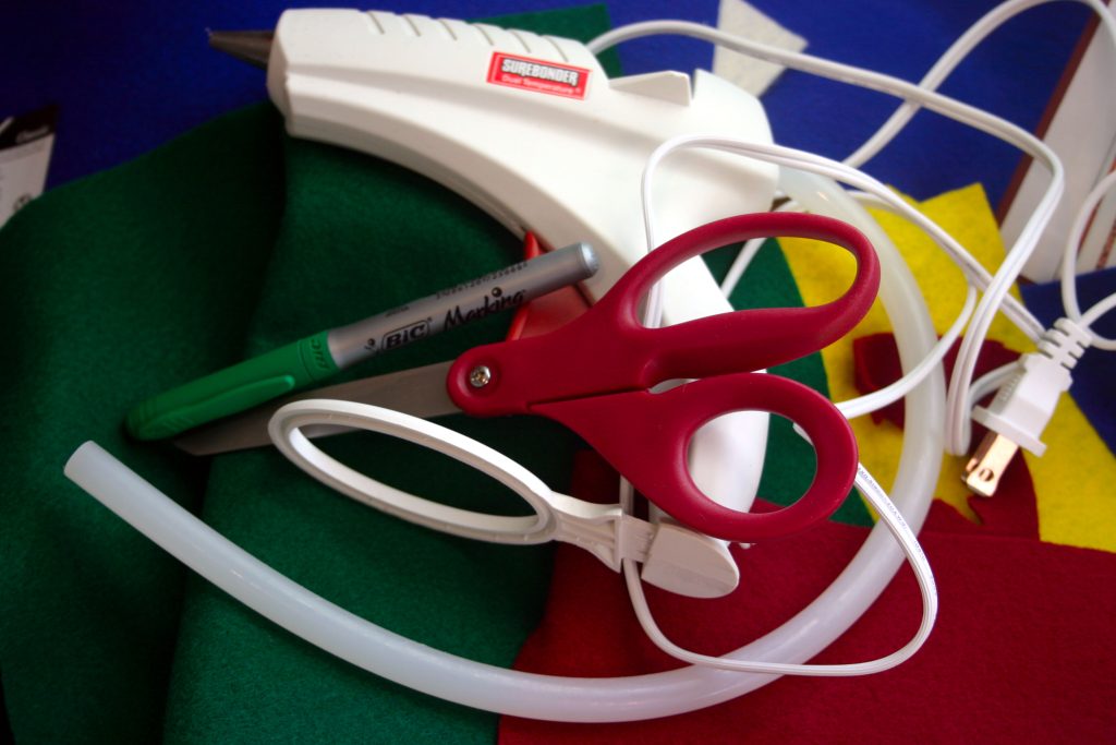 hot glue gun, marker, scissors, and felt