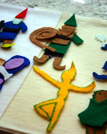 Many felt figures on a storyboard