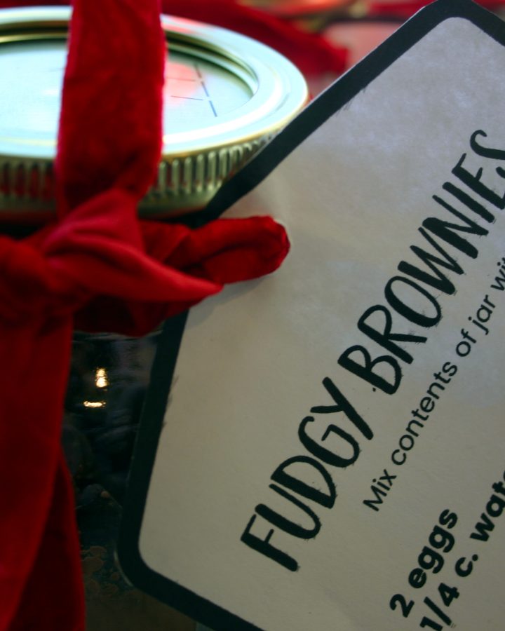 gift of homemade brownie mix in a jar with a red ribbon